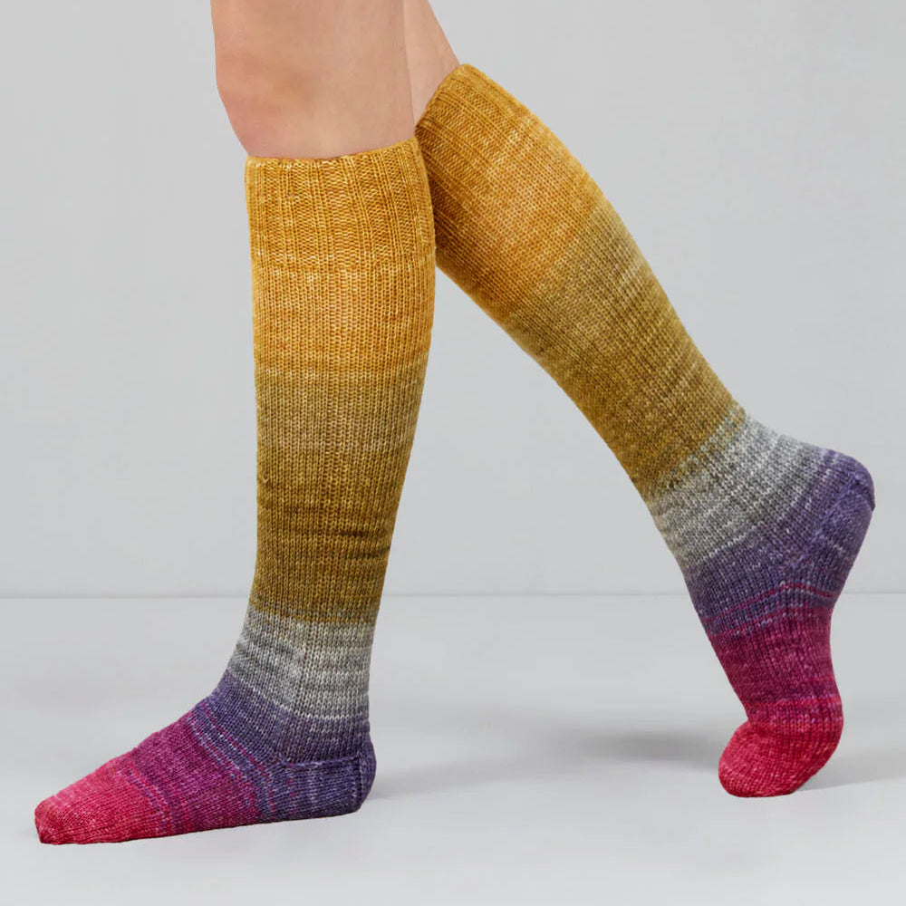 Colorful striped socks on a plain background