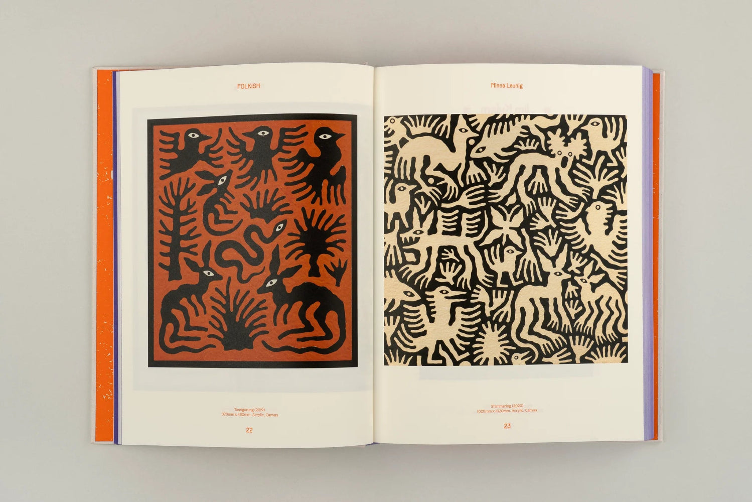 Open book displaying black and white animal patterns on a gray background