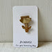 A gold metal hummingbird pin displayed on a white backing card that reads '80.HOUSE For your humming day.