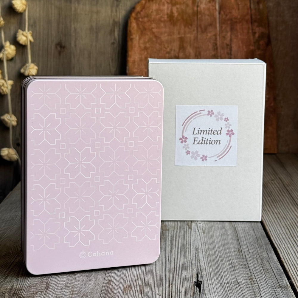 Pink notebook with geometric pattern and 'Limited Edition' box on wooden surface