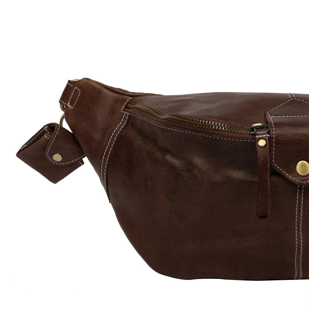 Brown leather waist bag on a white background