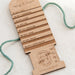 Wooden yarn weight chart with measurements on a white background
