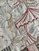 Embroidered design on fabric with circus-themed elements including a balloon, umbrella, and star.