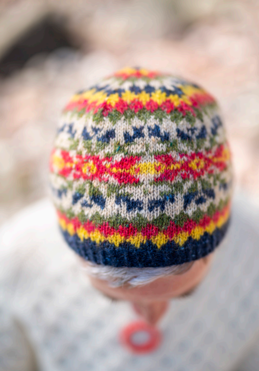 Colorful knitted hat with a blurred background