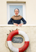 Woman in a window with a life buoy and 'The Lookout' sign below.