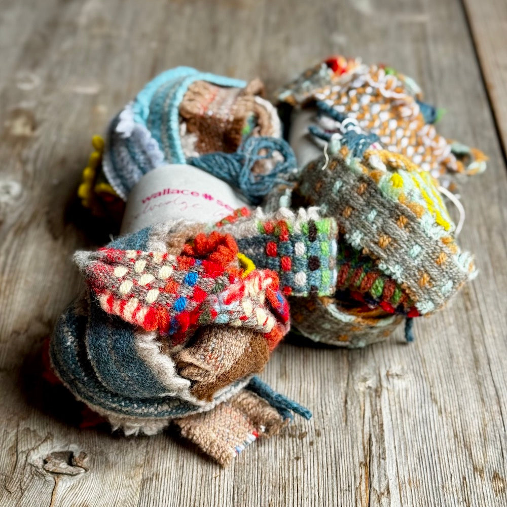 Colorful fabric ribbons items on a wooden surface