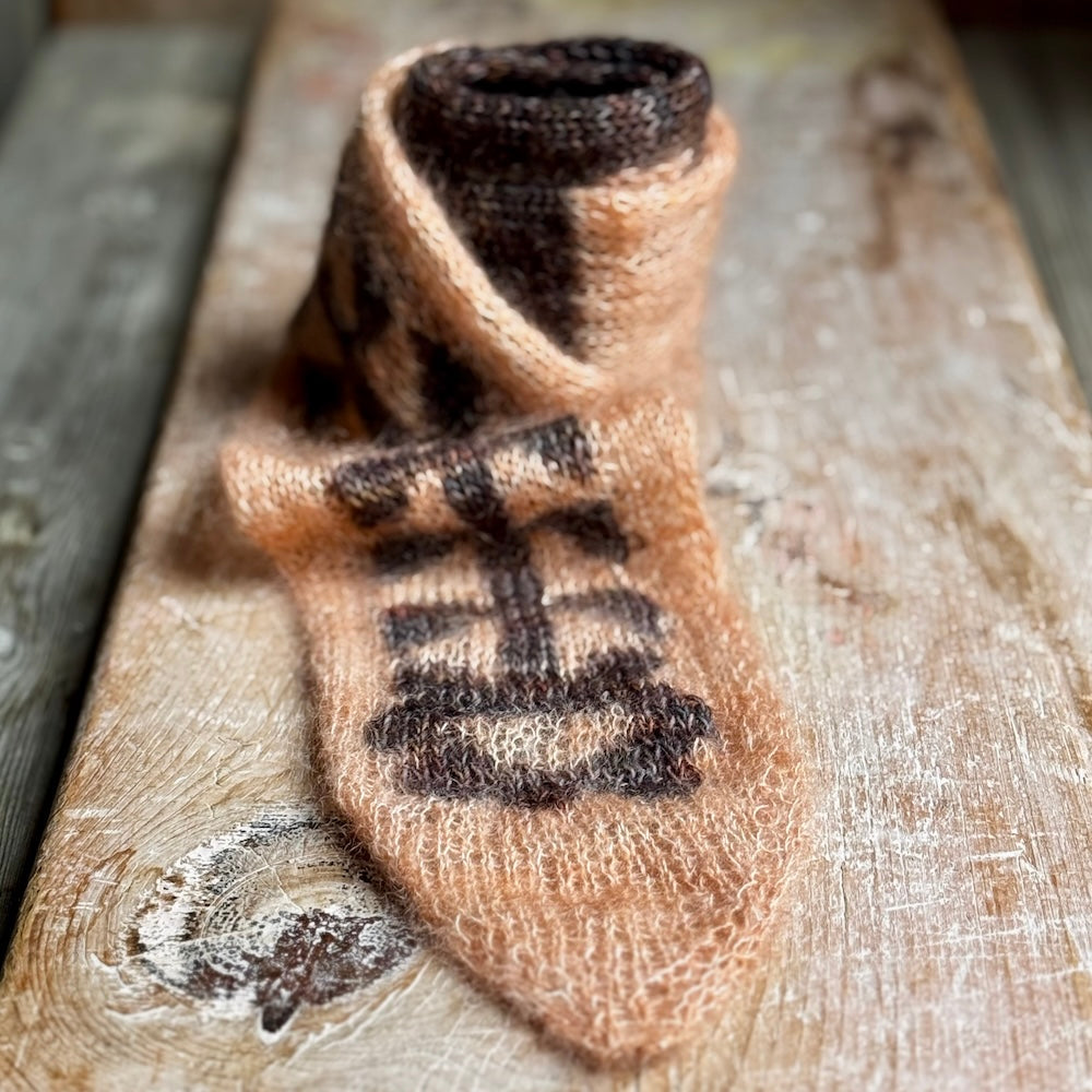 Textured wooden surface  with silk mohair yarn scarf 