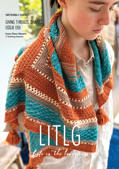 Person wearing a colorful knitted shawl with 'LITLG' branding on a magazine cover.