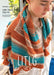Person wearing a colorful knitted shawl with 'LITLG' branding on a magazine cover.