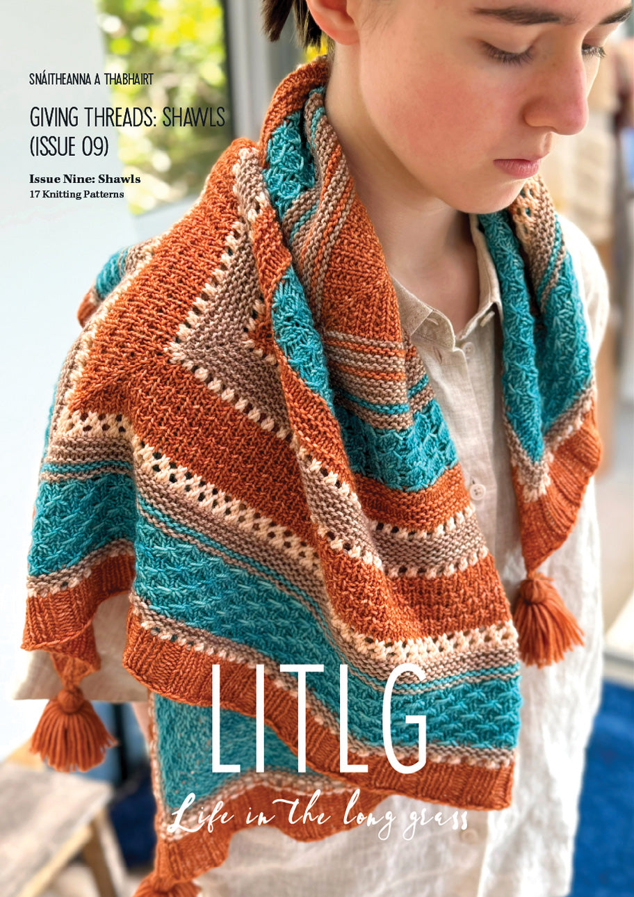 Person wearing a colorful knitted shawl with 'LITLG' branding on a magazine cover.