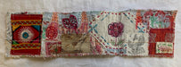 Decorative fabric strip with colorful patterns on a white background