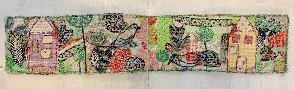 Decorative strip with houses, trees, and animals on a white background