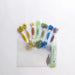 Set of colorful embroidery floss spools on a white background