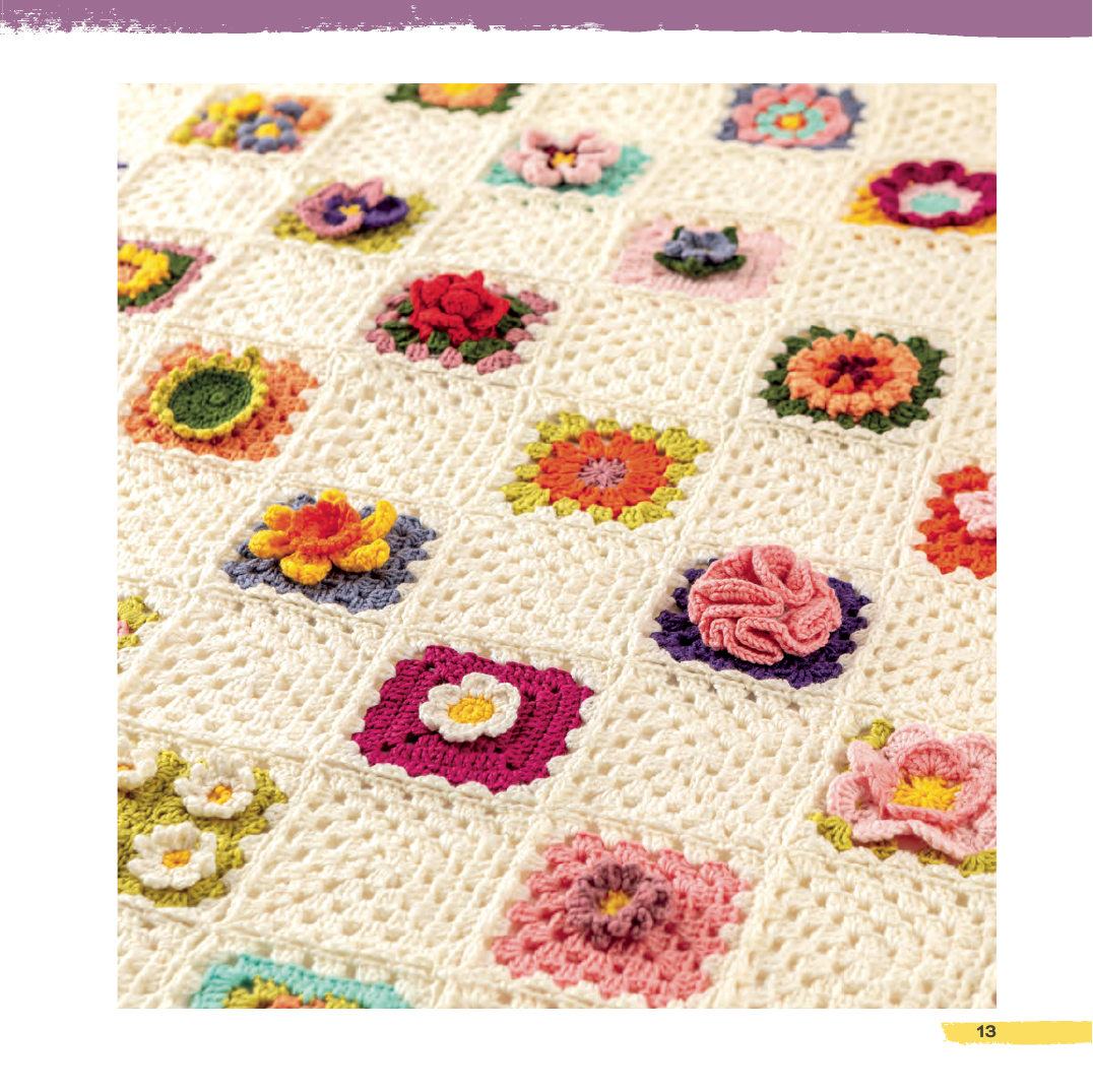 Crocheted blanket with colorful floral patterns on a white background