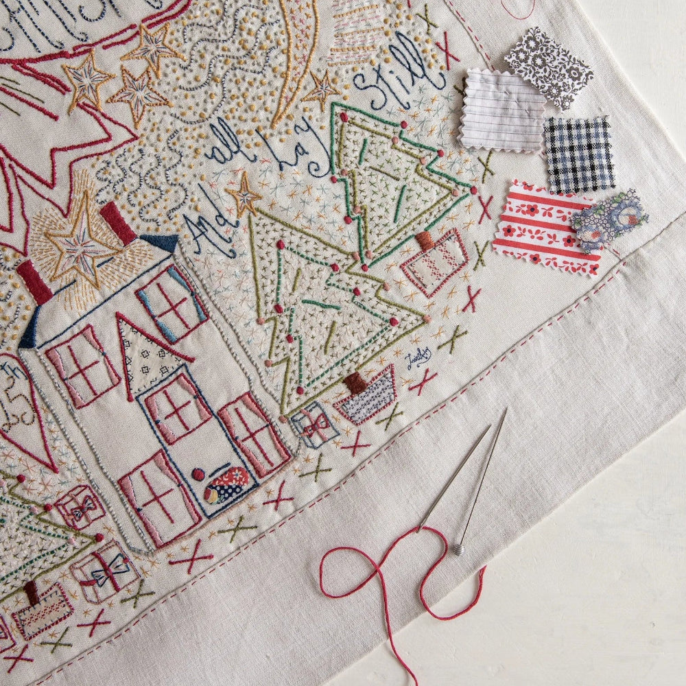 Embroidery with Christmas-themed design on fabric