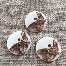 Brown Rabbit on matte white river shell button